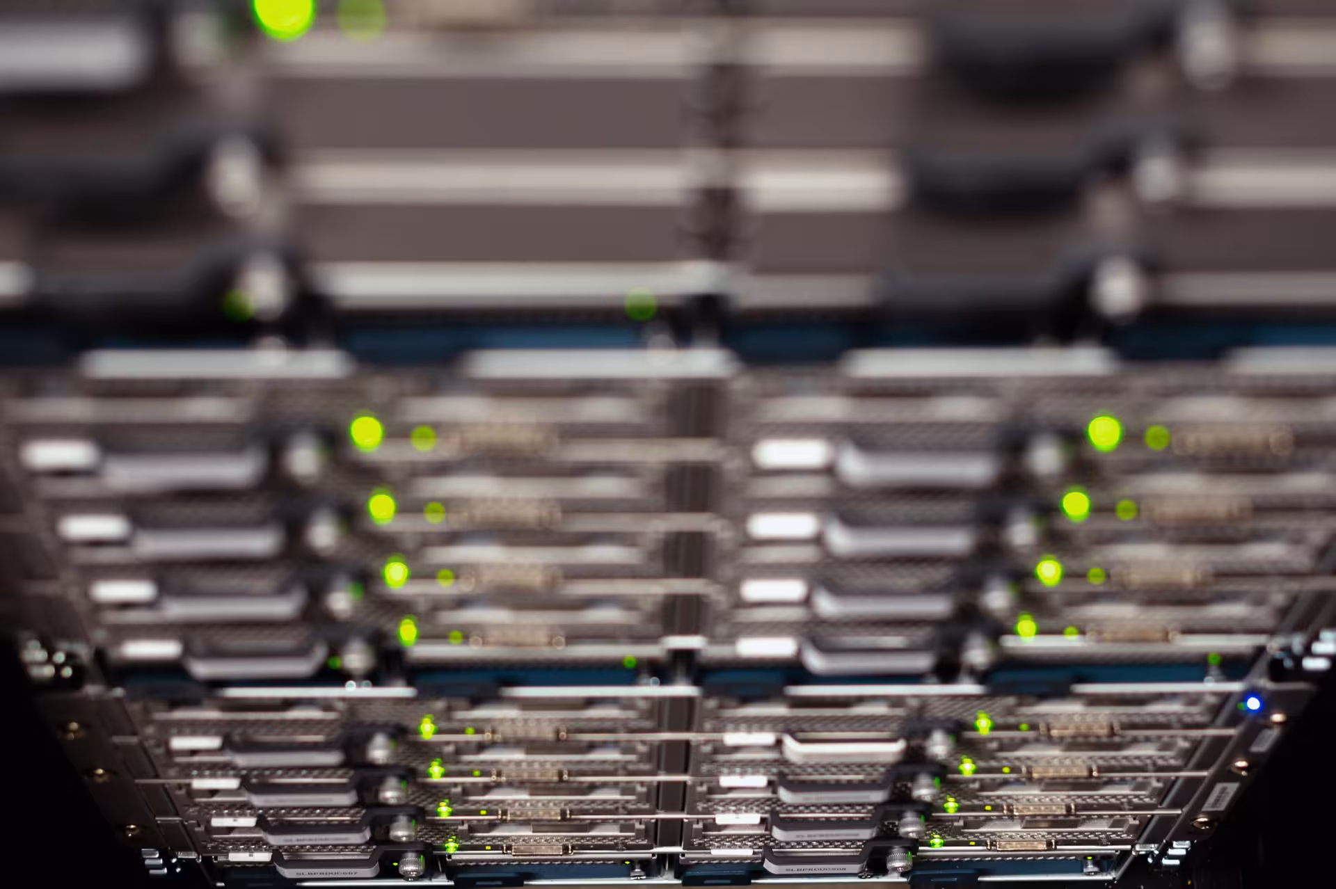 Close-up of a network server rack with blinking LED