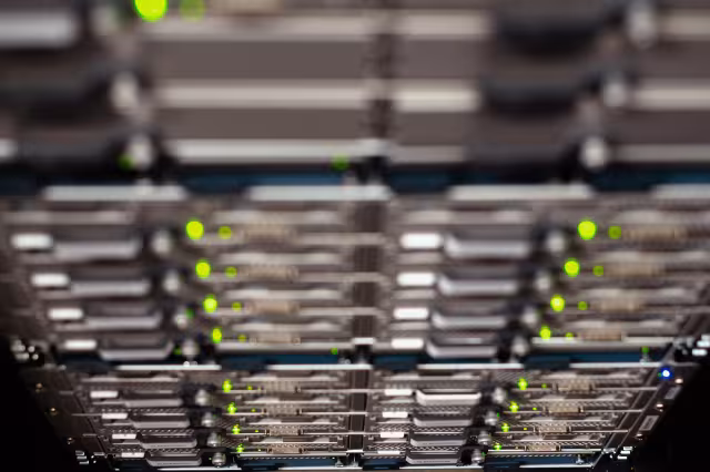 Close-up of a network server rack with blinking LED